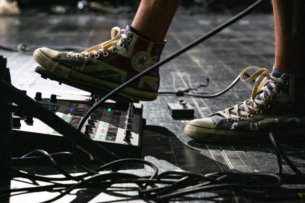 Person wearing Union Jack Converse all star high top sneakers